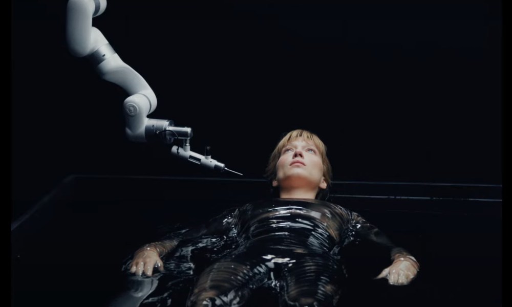 A woman is probed by a machine in The Beast.