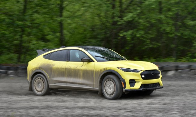 2024 Ford Mustang Mach-E Rally driving on dirt.