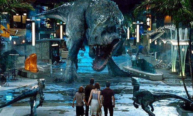 A t-rex stalks two raptors and four humans.