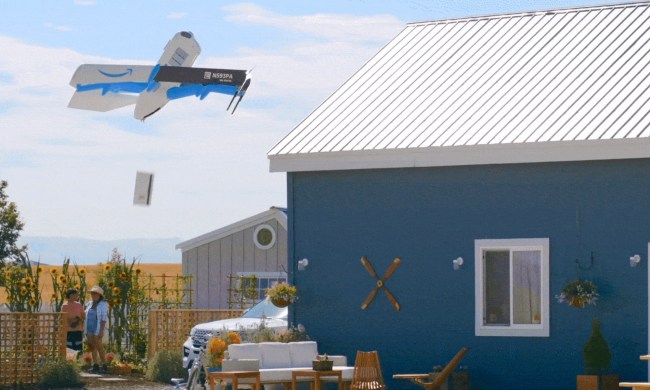 An Amazon delivery drone dropping off a package.