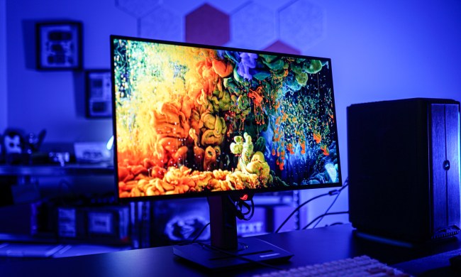 An Asus gaming monitor sitting on a table.
