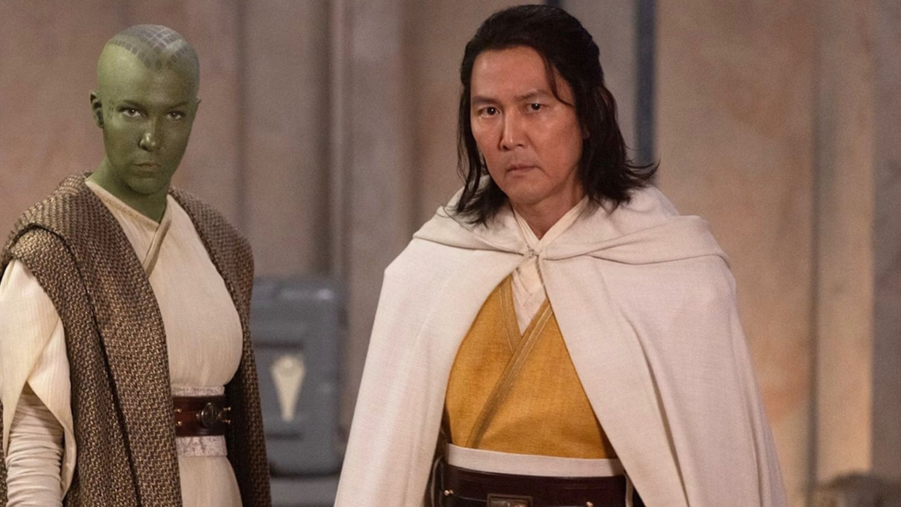 Lee Jung-jae with long hair dressed in a robe, and another Jedi behind him in Star Wars: The Acolyte.