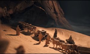 Figures walking through the dessert in Civilization 7.