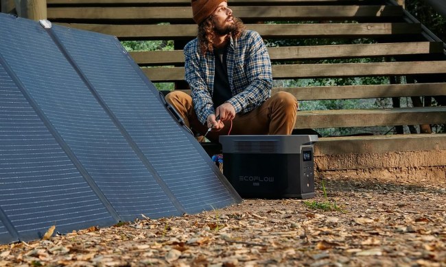 A man using the EcoFlow Delta 2 Max outdoors.