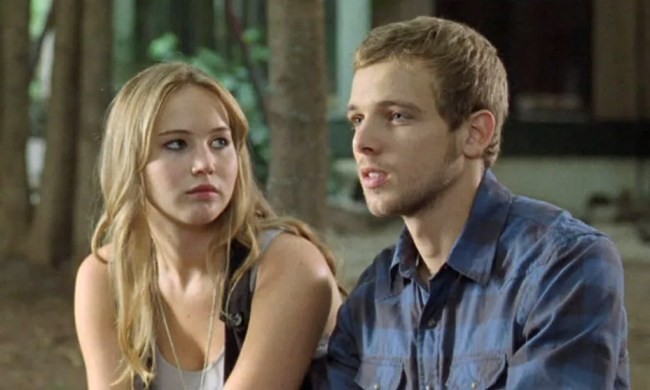 A girl looks at a boy in House at the End of the Street.