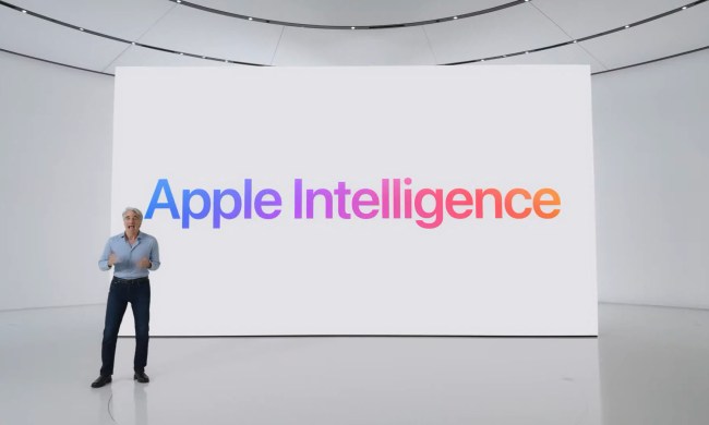 Craig in front of a screen reading Apple Intelligence