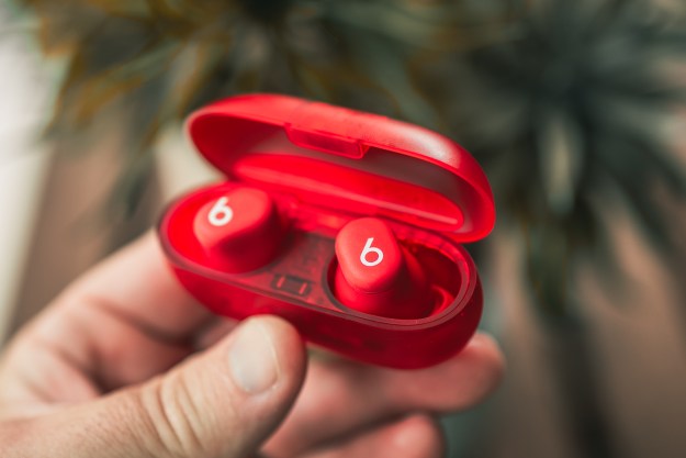 The Beats Solo Buds in their red translucent case.