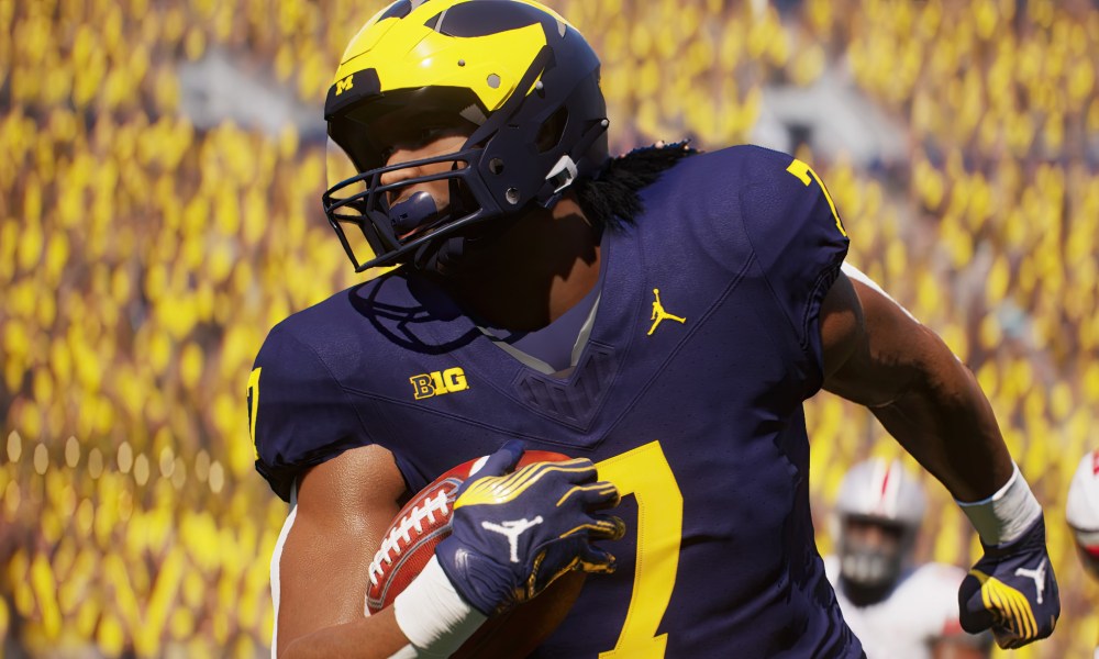 A player holds a football in EA Sports College Football 25.