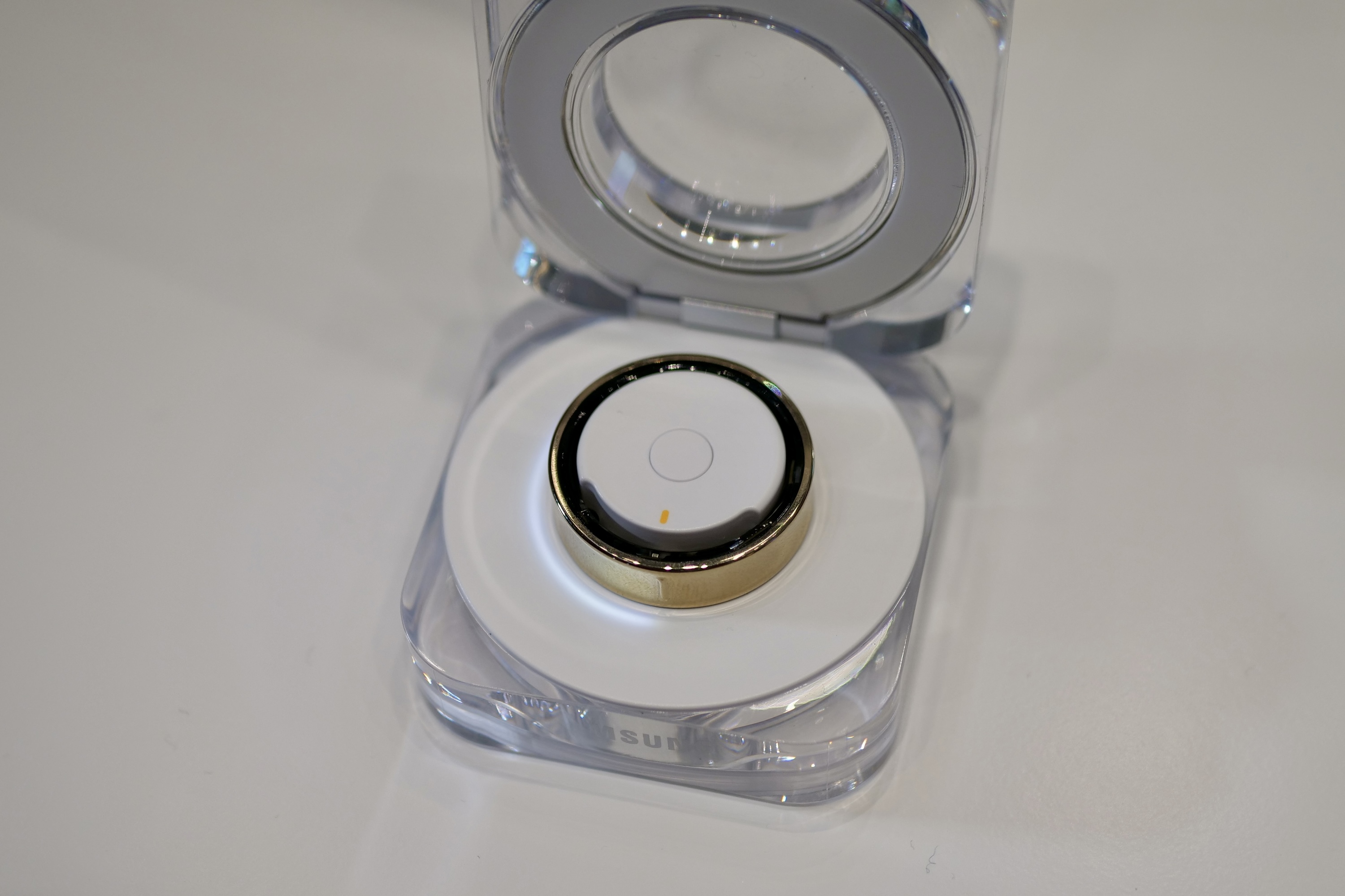 The Samsung Galaxy Ring in its charging case.