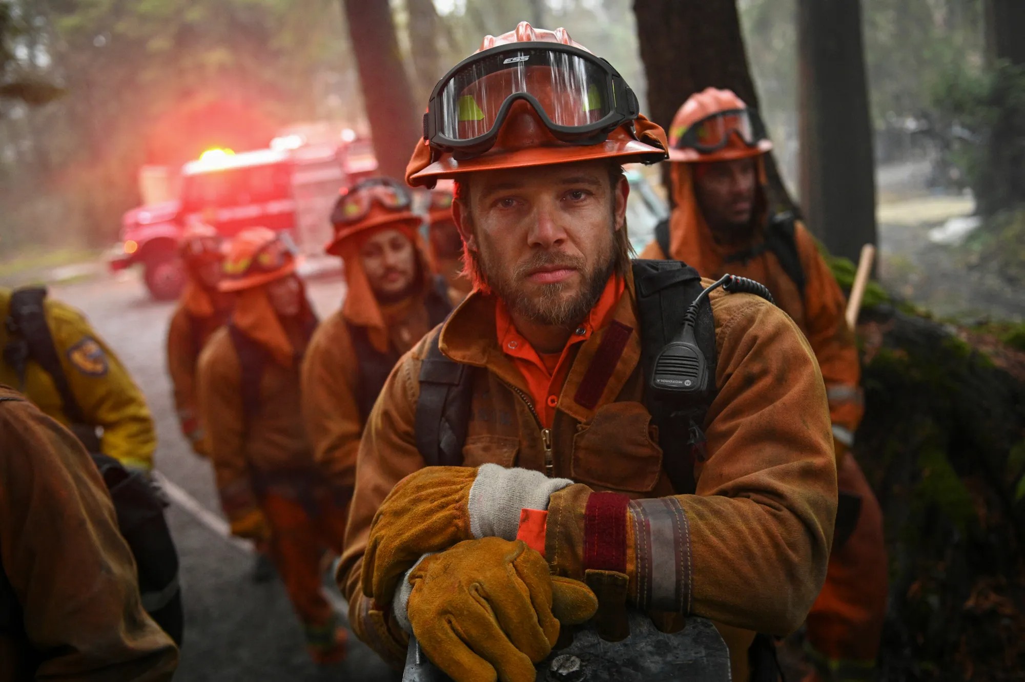 Several fireman look at the camera in Fire Country.