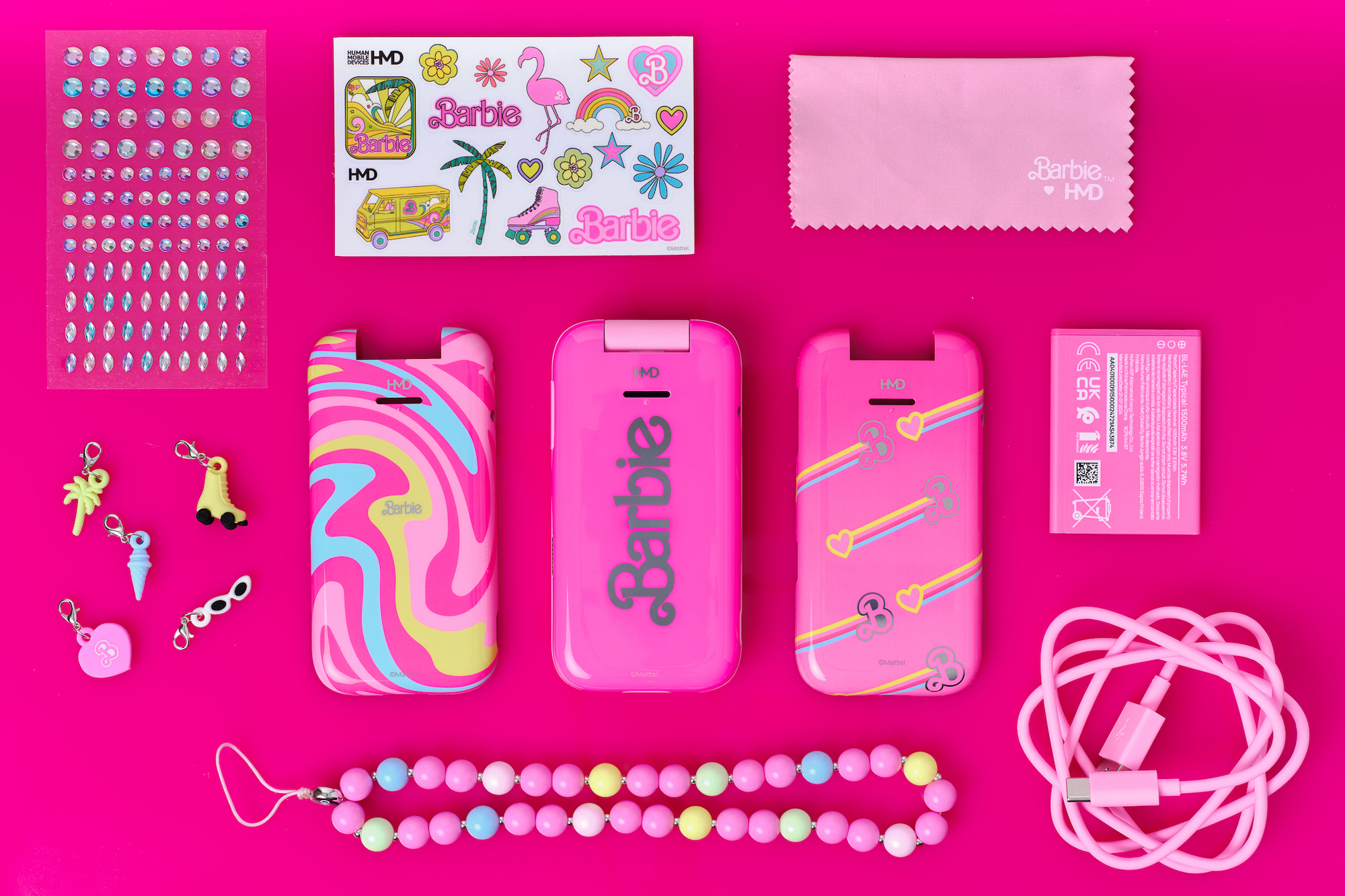 A promotional image showing the HMD Barbie Phone's accessories.