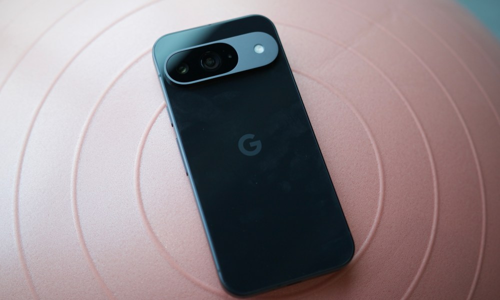 A black Google Pixel 9 laying face-down on an exercise ball.