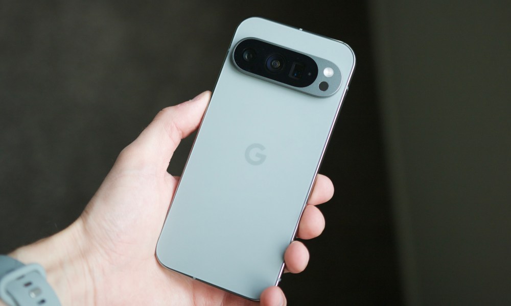 Someone holding the Hazel Google Pixel 9 Pro.