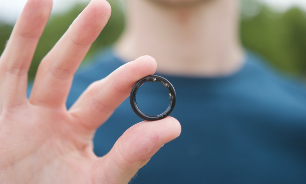 Someone holding the Samsung Galaxy Ring.