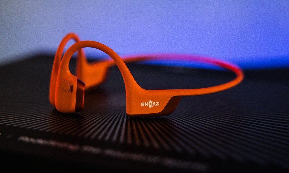 The Shokz OpenRun Pro 2 headphones in orange.