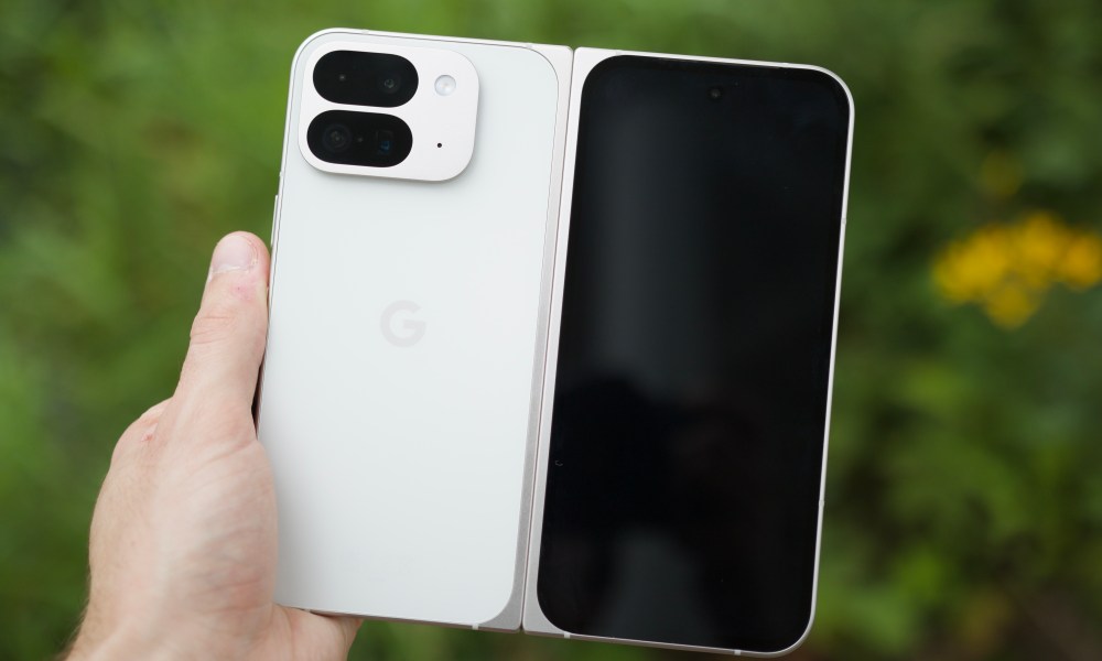 Someone holding the Google Pixel 9 Pro Fold, showing the back of the phone.