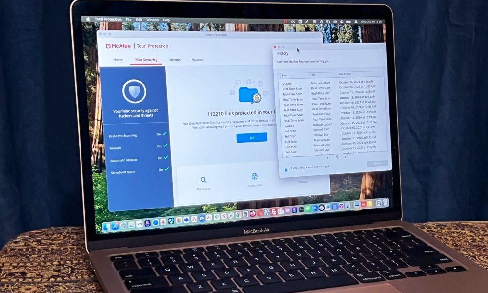 McAfee+ Premium's Total Protection app is open on a MacBook Air.