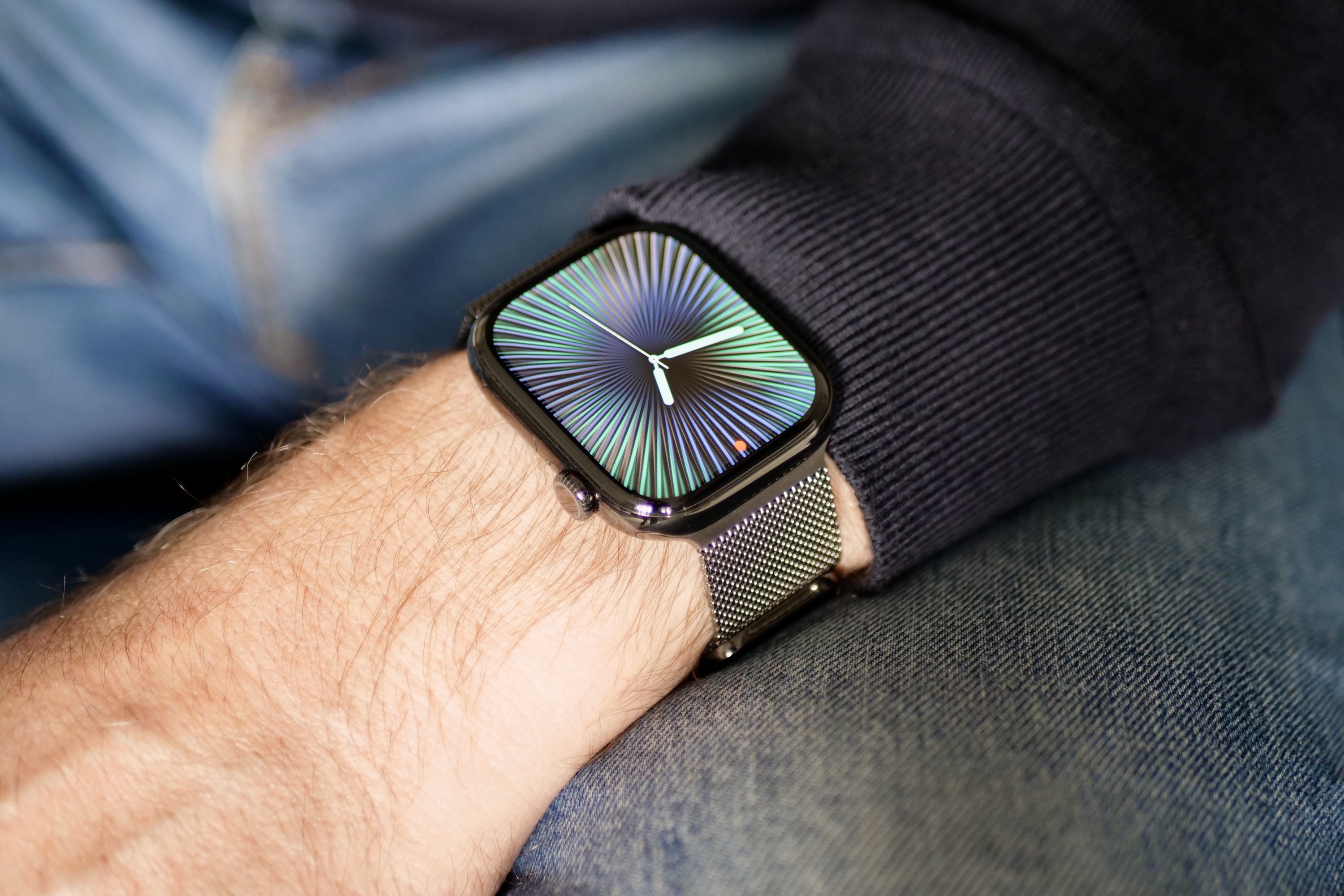 A person wearing the titanium Apple Watch Series 10.