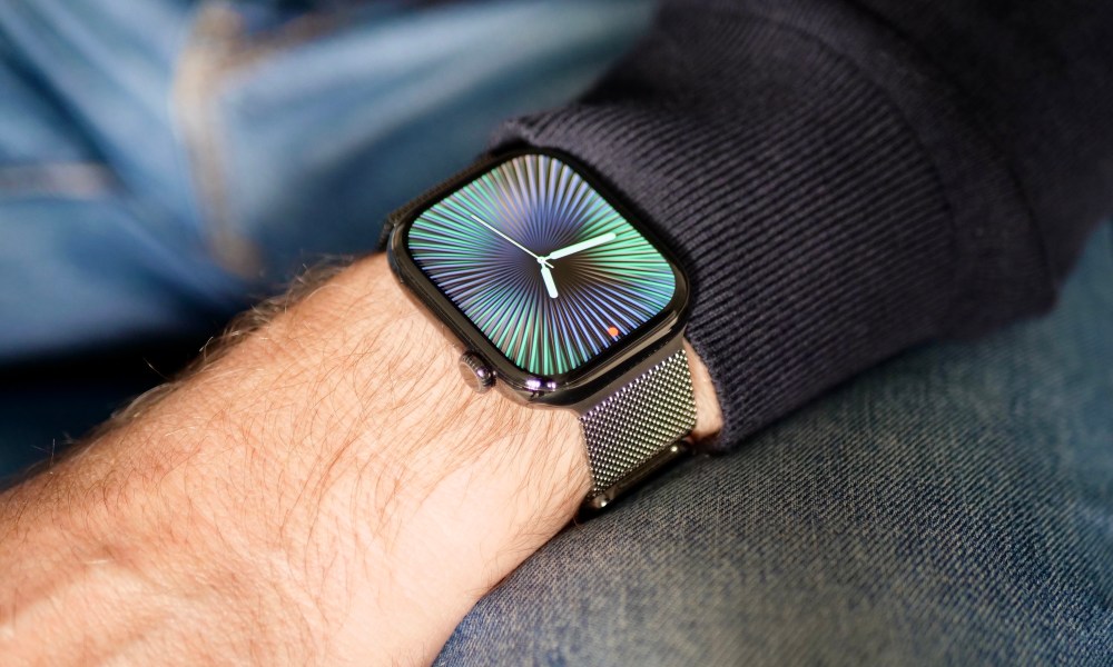 A person wearing the titanium Apple Watch Series 10.