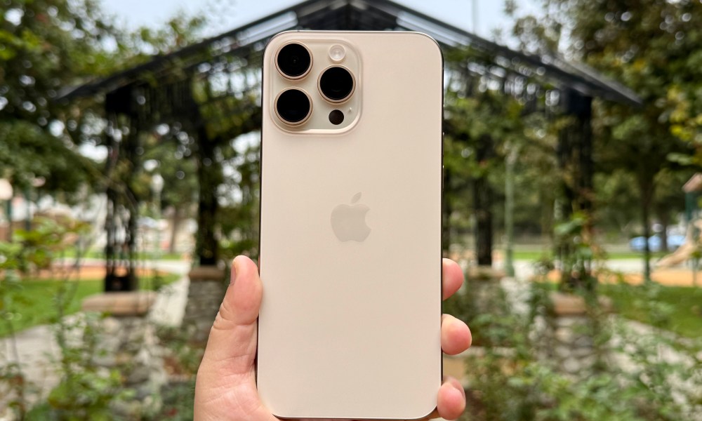 iPhone 16 Pro Max in Desert Titanium.