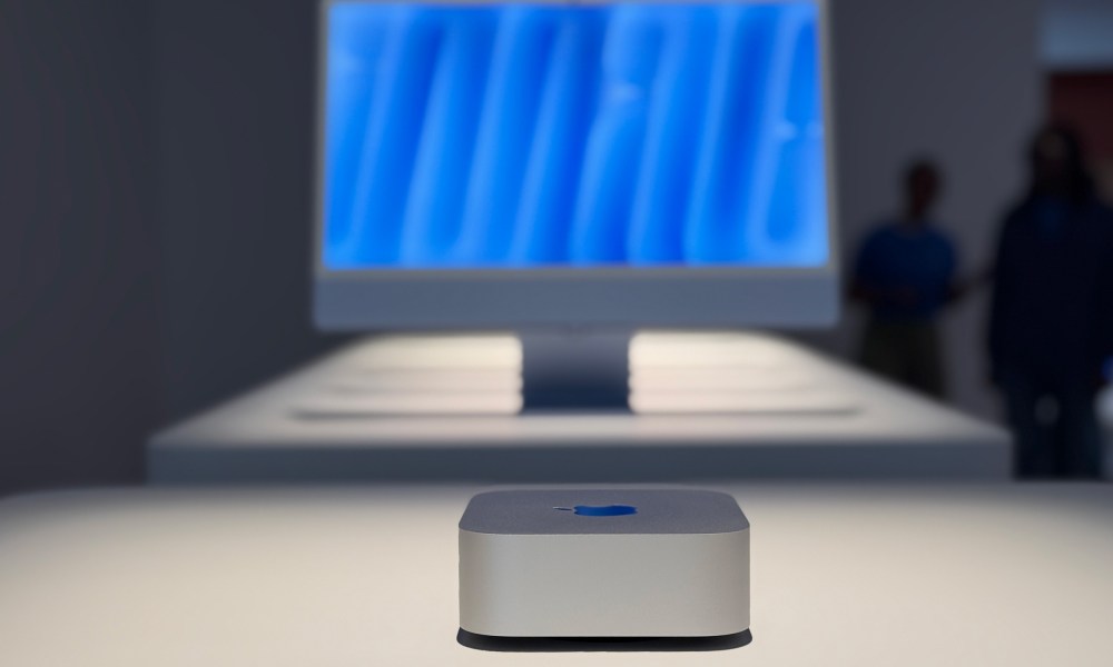 The M4 Mac mini with a display in the background.