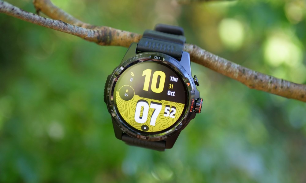 The Mobvoi TicWatch Atlas hanging from a branch.