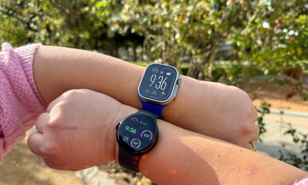 Someone wearing an Apple Watch Ultra and Pixel Watch 3 on different wrists.