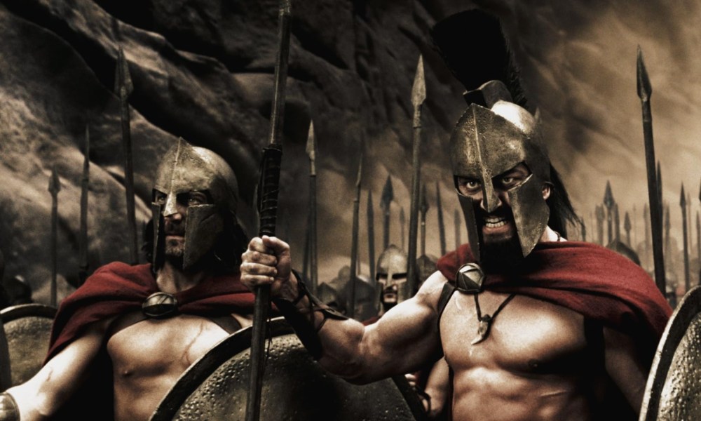 Spartan soldiers wield their weapons in 300.