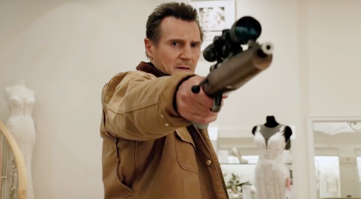 A man aims a gun in Cold Pursuit.