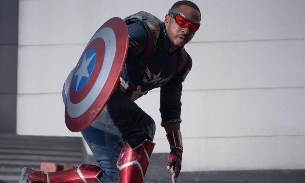 Anthony Mackie holds a shield as Captain America.